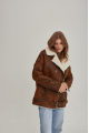 Women's sheepskin coat in a vintage style, made of natural sheepskin in the color of whiskey