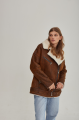 Women's sheepskin coat in a vintage style, made of natural sheepskin in the color of whiskey