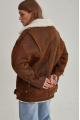 Women's sheepskin coat in a vintage style, made of natural sheepskin in the color of whiskey