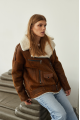 Women's sheepskin coat in a vintage style, made of natural sheepskin in the color of whiskey