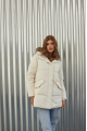 Women's down jacket of white color with a hare fur trim