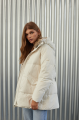 Women's down jacket of white color with a hare fur trim