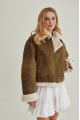 Women's short sheepskin coat made of natural sheepskin in a vintage style in brown color