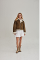 Women's short sheepskin coat made of natural sheepskin in a vintage style in brown color