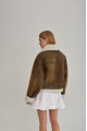 Women's short sheepskin coat made of natural sheepskin in a vintage style in brown color