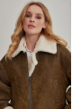 Women's short sheepskin coat made of natural sheepskin in a vintage style in brown color