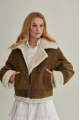 Women's short sheepskin coat made of natural sheepskin in a vintage style in brown color