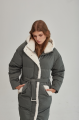 Stylish green women's down jacket with natural filler and sheepskin fur trim