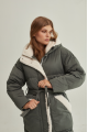 Stylish green women's down jacket with natural filler and sheepskin fur trim