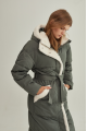 Stylish green women's down jacket with natural filler and sheepskin fur trim