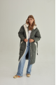 Stylish green women's down jacket with natural filler and sheepskin fur trim