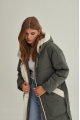 Stylish green women's down jacket with natural filler and sheepskin fur trim