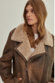 Vintage women's sheepskin coat made of brown natural sheepskin