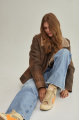 Vintage women's sheepskin coat made of brown natural sheepskin