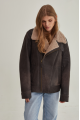 Women's sheepskin coat of gray color in vintage style