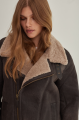 Women's sheepskin coat of gray color in vintage style