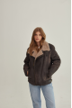 Women's sheepskin coat of gray color in vintage style