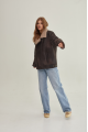 Women's sheepskin coat of gray color in vintage style