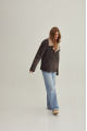 Women's sheepskin coat of gray color in vintage style