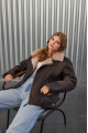 Women's sheepskin coat of gray color in vintage style