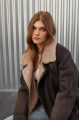 Women's sheepskin coat of gray color in vintage style