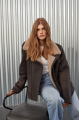 Women's sheepskin coat of gray color in vintage style