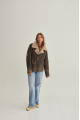 Women's sheepskin coat of brown color in American vintage style