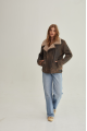 Women's sheepskin coat of brown color in American vintage style