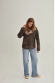 Women's sheepskin coat of brown color in American vintage style