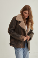 Women's sheepskin coat of brown color in American vintage style