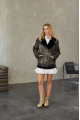 A black sheepskin coat made of natural sheepskin in the VINTAGE style