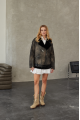 A black sheepskin coat made of natural sheepskin in the VINTAGE style