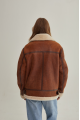 A stylish vintage sheepskin coat made of natural sheepskin in the color of whiskey