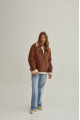 A stylish vintage sheepskin coat made of natural sheepskin in the color of whiskey