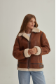 A stylish vintage sheepskin coat made of natural sheepskin in the color of whiskey