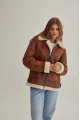 A stylish vintage sheepskin coat made of natural sheepskin in the color of whiskey