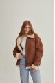 A stylish vintage sheepskin coat made of natural sheepskin in the color of whiskey