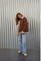 A stylish vintage sheepskin coat made of natural sheepskin in the color of whiskey