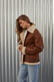 A stylish vintage sheepskin coat made of natural sheepskin in the color of whiskey