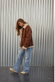 A stylish vintage sheepskin coat made of natural sheepskin in the color of whiskey