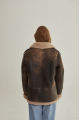 Women's sheepskin coat of brown color in vintage style