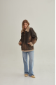 Women's sheepskin coat of brown color in vintage style