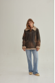 Women's sheepskin coat of brown color in vintage style