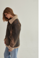 Women's sheepskin coat of brown color in vintage style