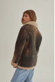 Women's sheepskin coat of brown color in vintage style