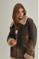 Women's sheepskin coat of brown color in vintage style