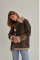 Women's sheepskin coat of brown color in vintage style