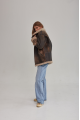 Women's sheepskin coat of brown color in vintage style