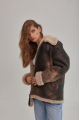 Women's sheepskin coat of brown color in vintage style