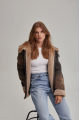 Women's sheepskin coat of brown color in vintage style